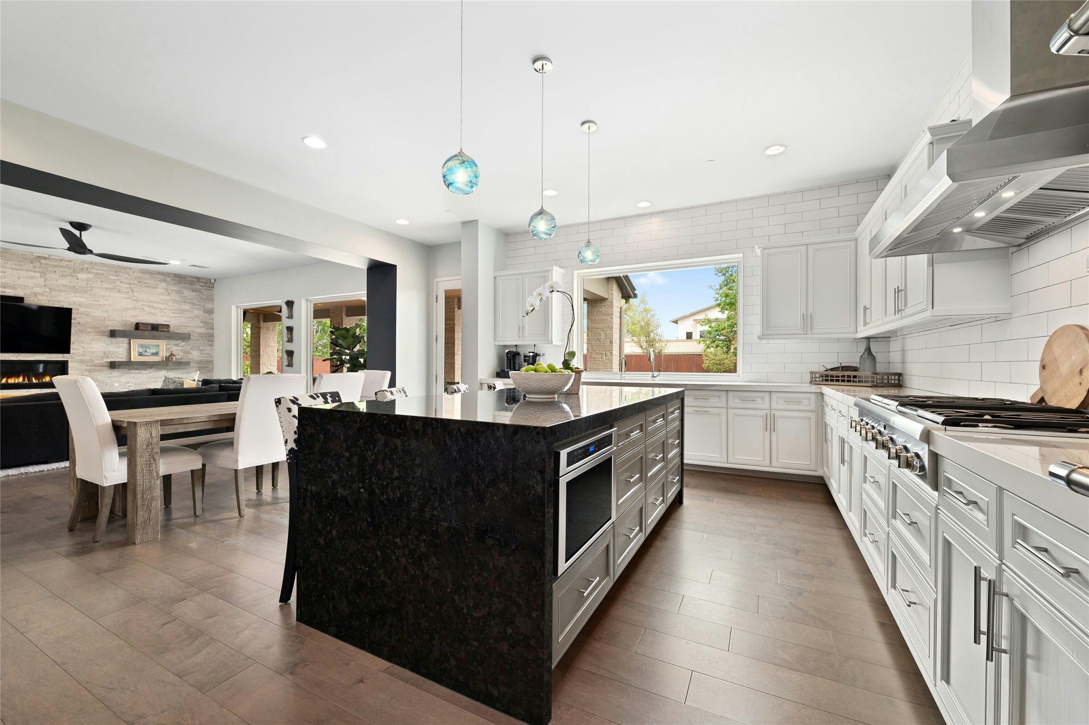 2201 Cypress Point West Austin, TX 78746 - Photo 8 of 37 a kitchen with stainless steel appliances granite countertop a stove a sink dishwasher and a refrigerator