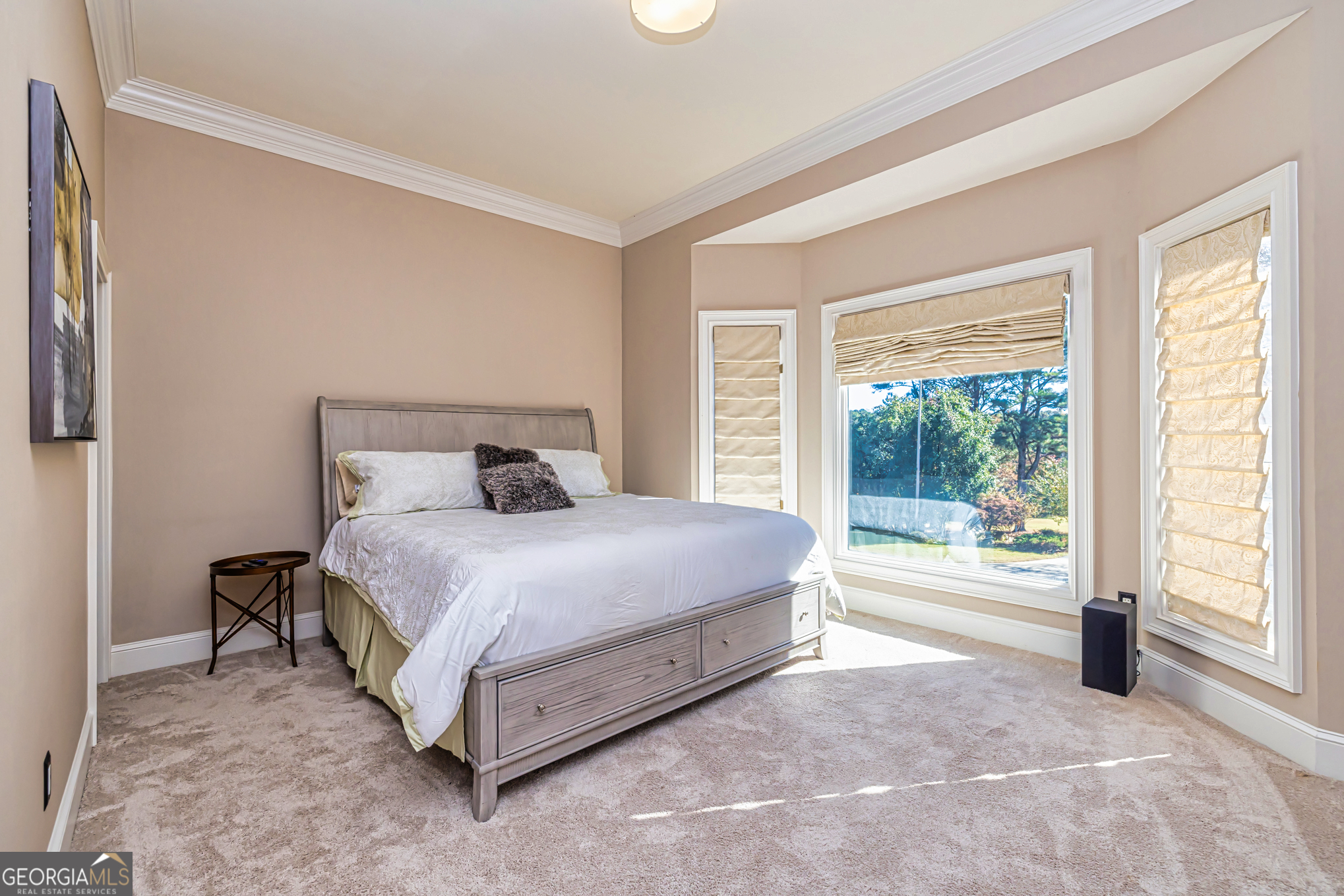131 Lincoln Road Tyrone, GA 30290 - Photo 16 of 78 a bedroom with a bed and a large window