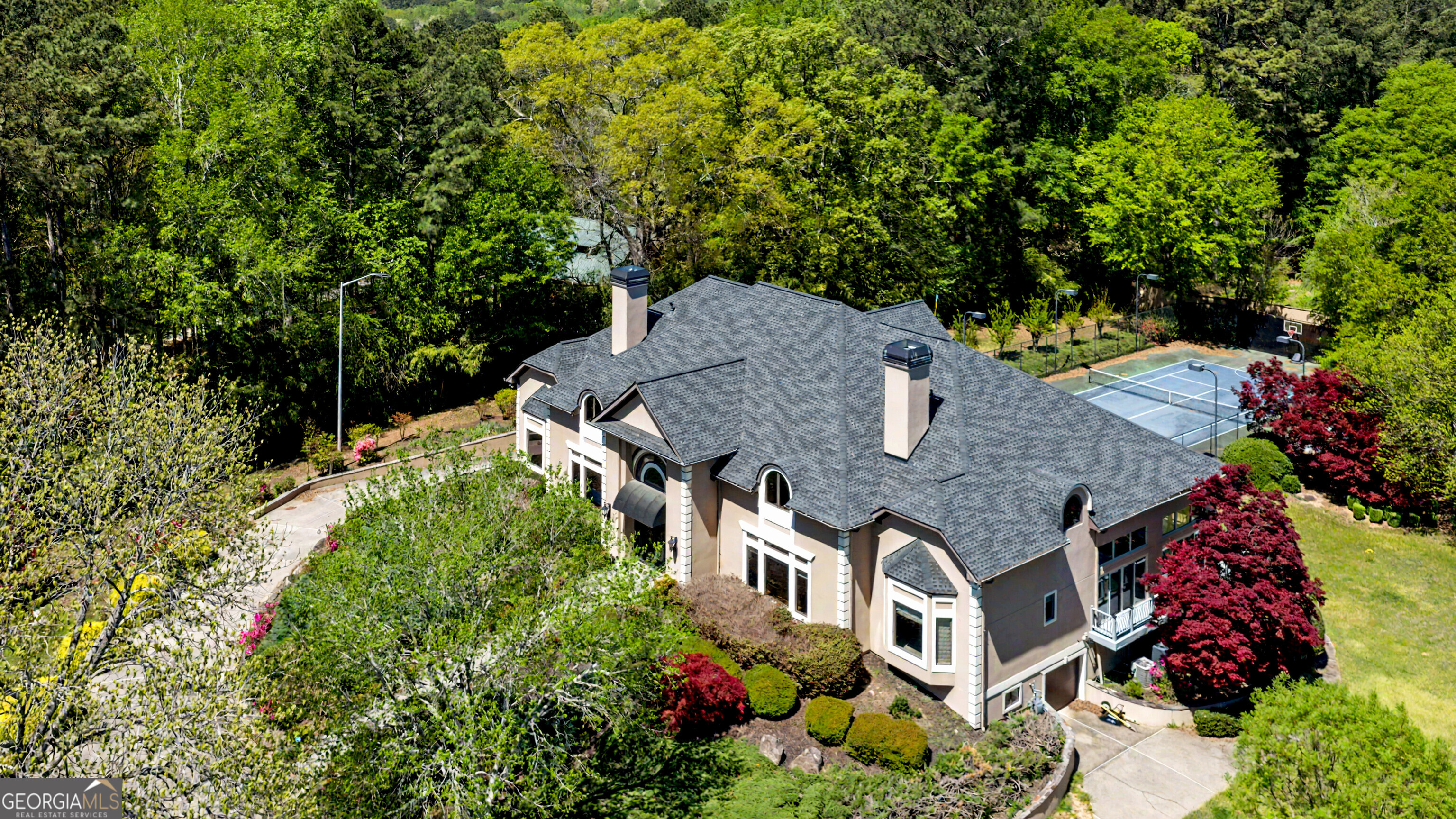 131 Lincoln Road Tyrone, GA 30290 - Photo 2 of 78 an aerial view of a house with a yard and large trees