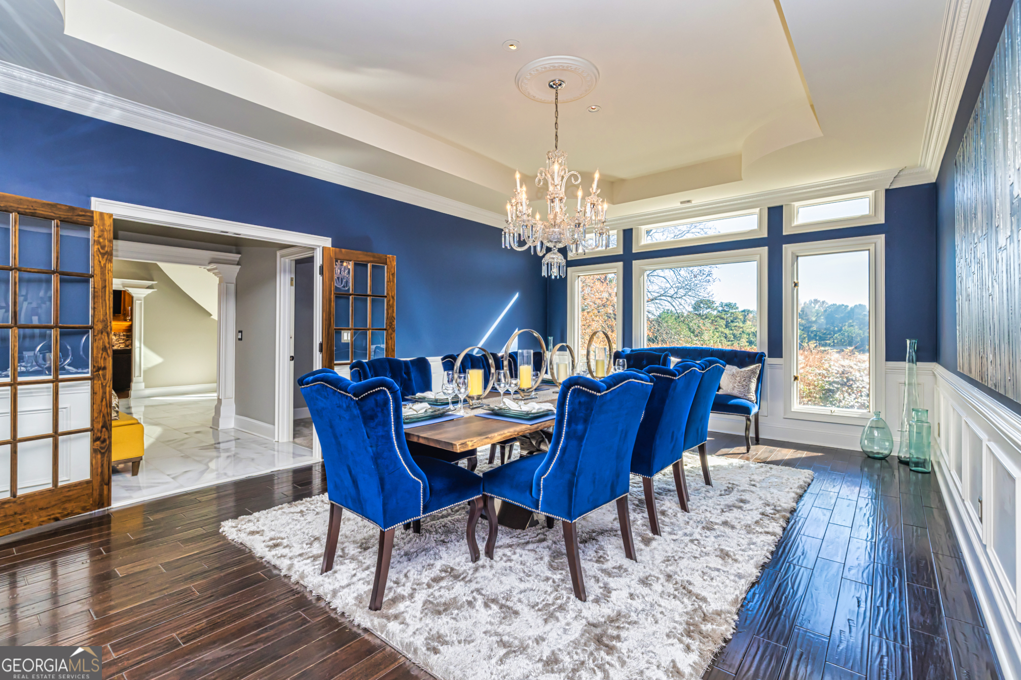 131 Lincoln Road Tyrone, GA 30290 - Photo 21 of 78 a view of a dining room with furniture a chandelier and wooden floor