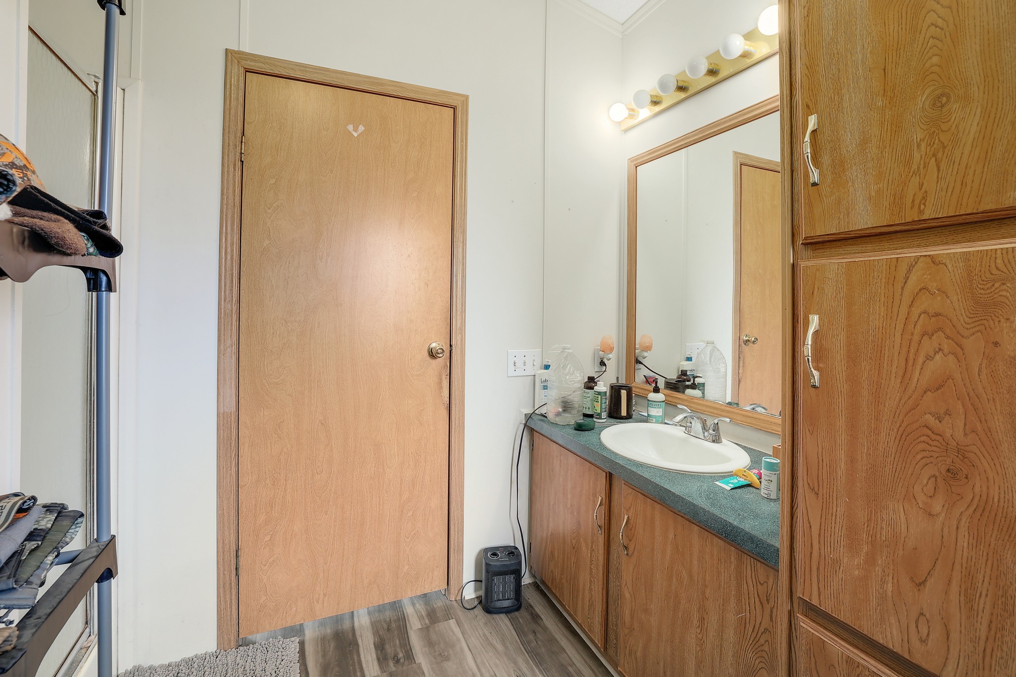 288 The Forest Road Dale, TX 78616 - Photo 16 of 31 a bathroom with a sink and a mirror