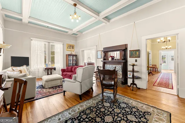 a living room with furniture and a fireplace