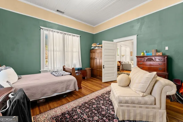 a bedroom with two beds and a couch