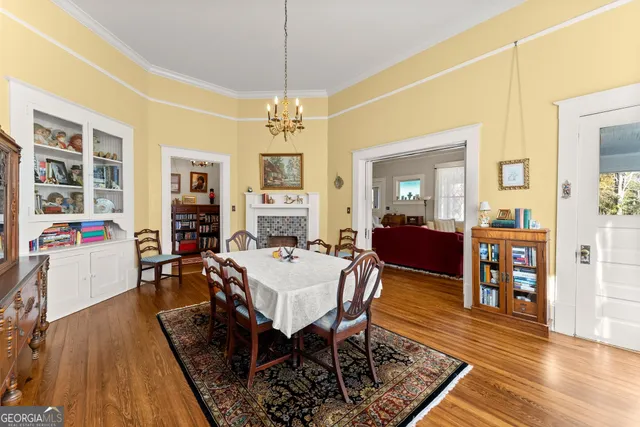 a view of a dining room with furniture window and wooden floor