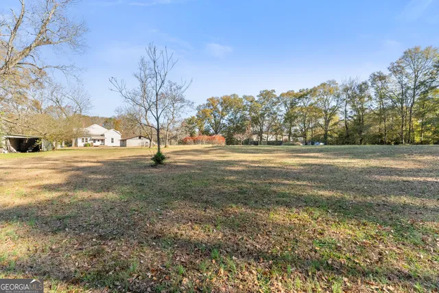 a view of a road with a yard