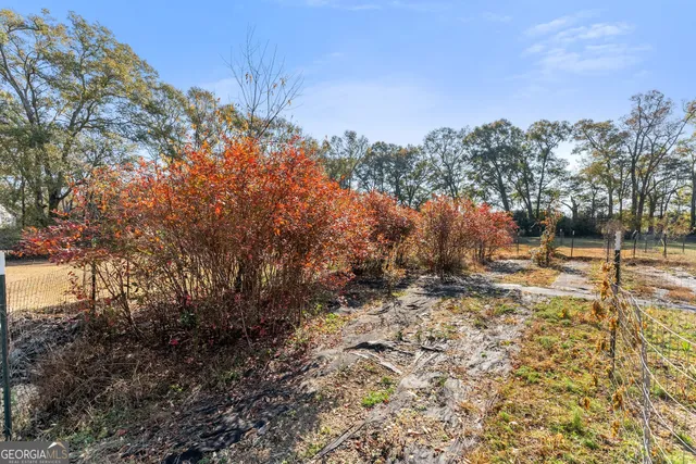 a backyard of a house with large trees