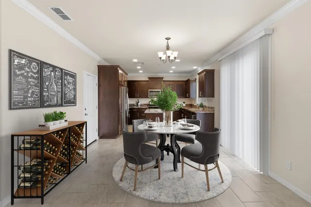 a kitchen with stainless steel appliances granite countertop a stove top oven a refrigerator and a sink