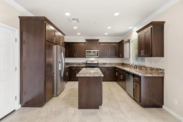 a kitchen with a stove and a microwave