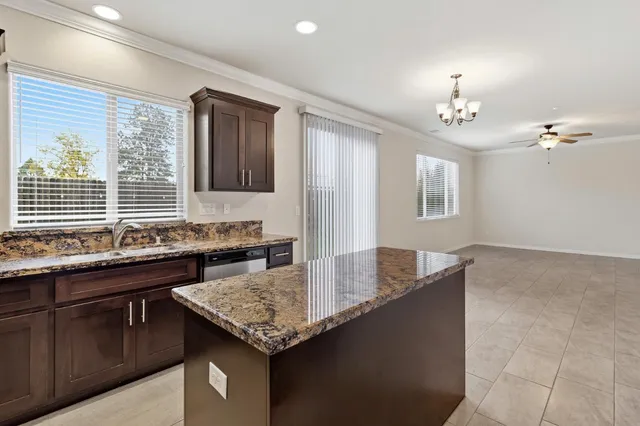a kitchen with a counter top space cabinets and stainless steel appliances