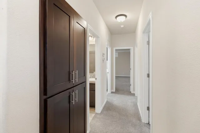 a bed room with a bed and a chair