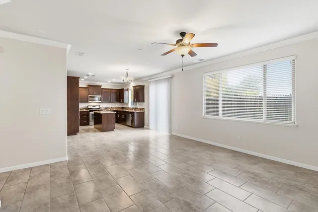 a open kitchen with cabinets and stainless steel appliances