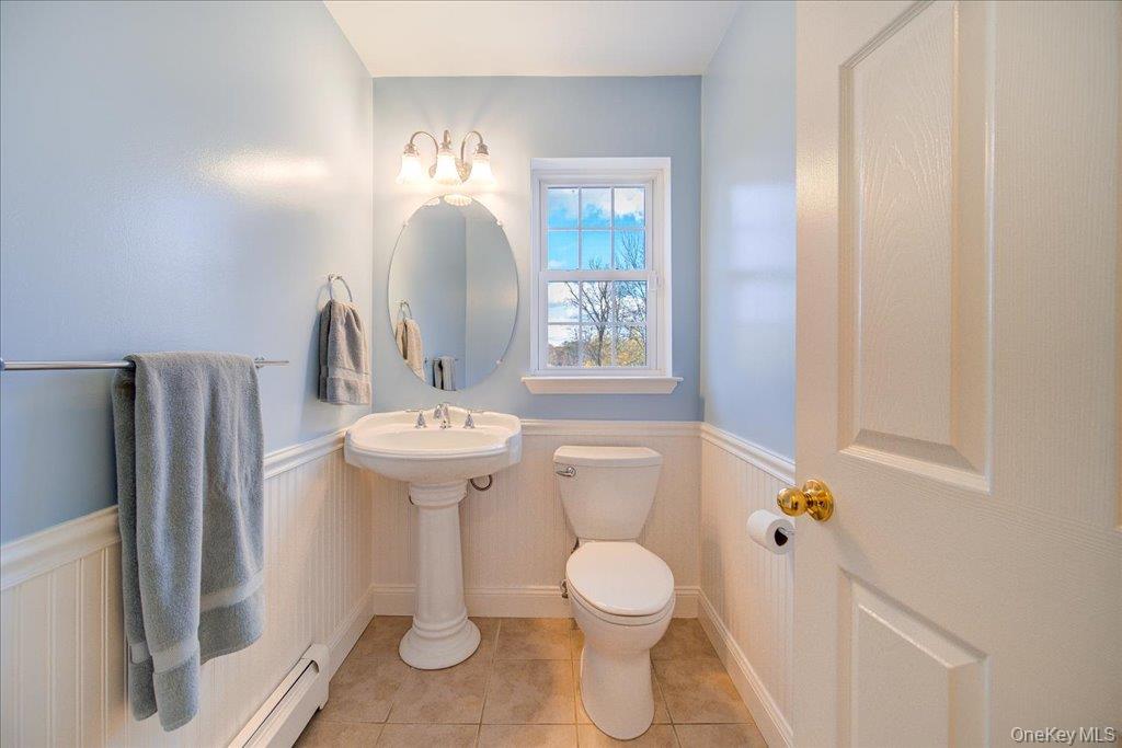 34 Twin Lakes Road Monroe, NY 10950 - Photo 16 of 35 a bathroom with a toilet sink and mirror