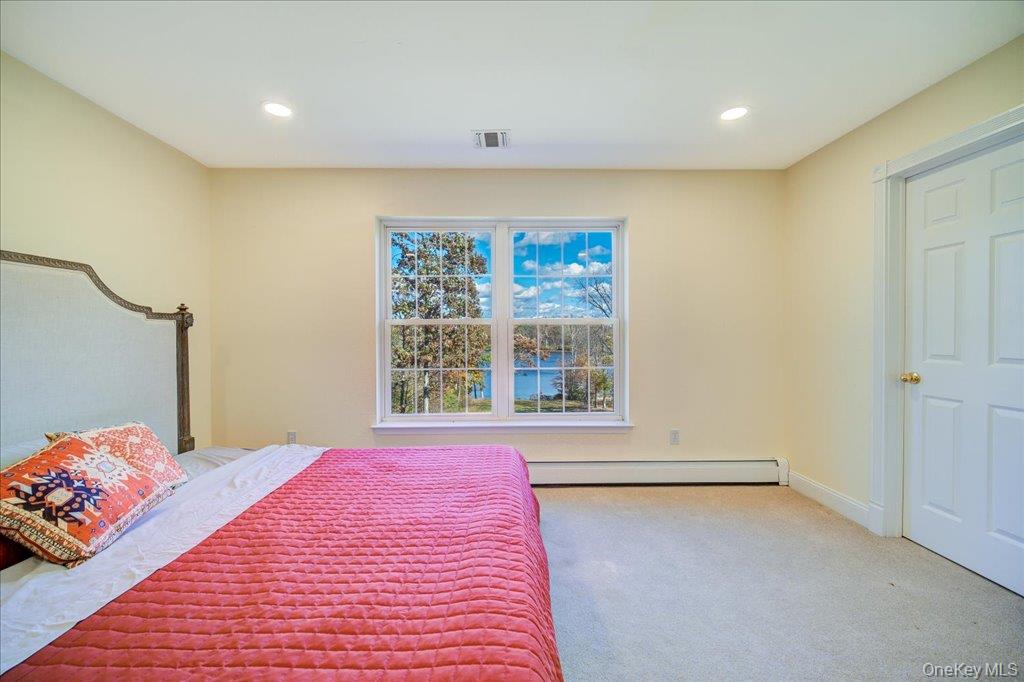34 Twin Lakes Road Monroe, NY 10950 - Photo 23 of 35 a view of a bedroom with a bed and a window