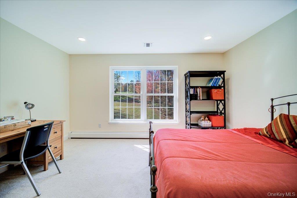 34 Twin Lakes Road Monroe, NY 10950 - Photo 25 of 35 a bedroom with a bed and a bookshelf