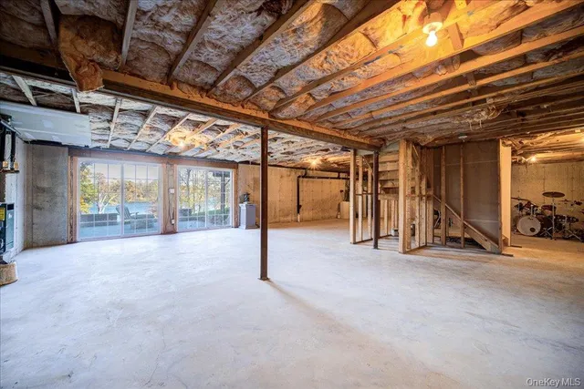 a view of empty room with wooden walls