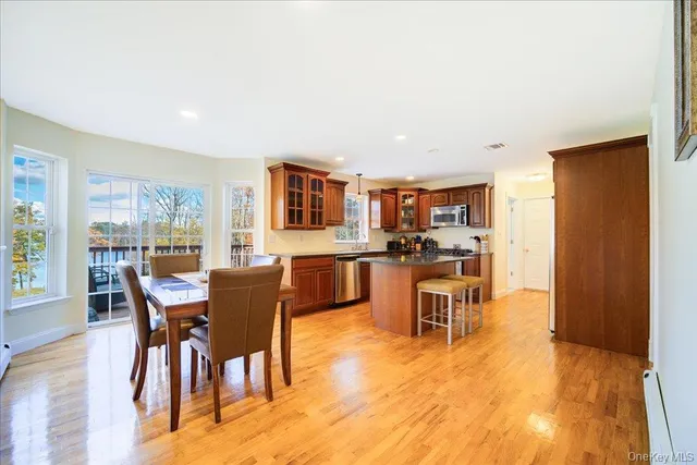 a dining room with furniture and wooden floor