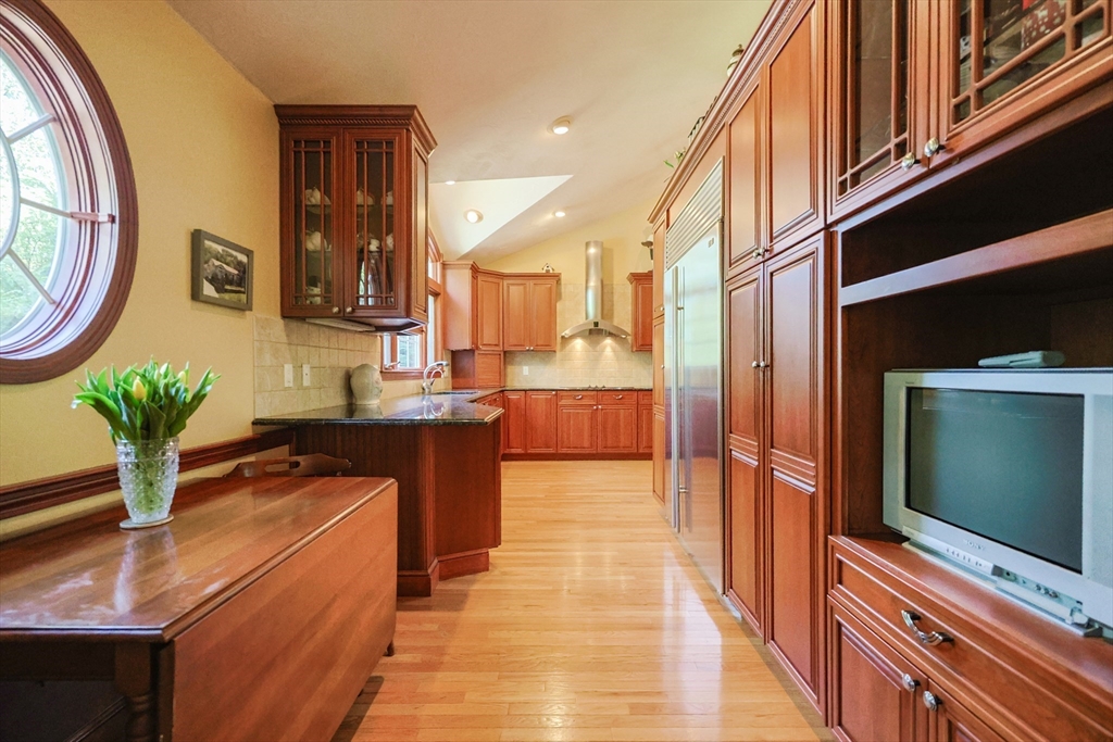 60 Deerfield Road Needham, MA 02492 - Photo 11 of 31 a hallway with dining table and chairs