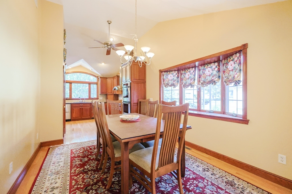 60 Deerfield Road Needham, MA 02492 - Photo 15 of 31 a view of a dining room with furniture and a chandelier