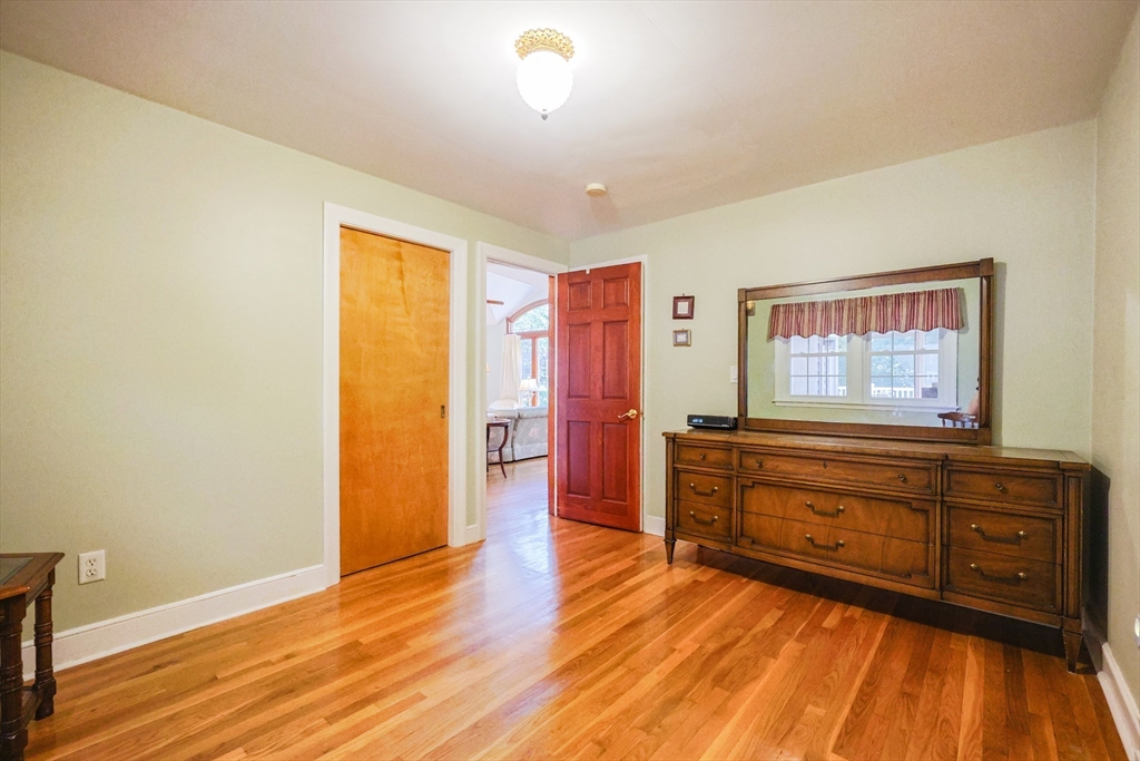 60 Deerfield Road Needham, MA 02492 - Photo 25 of 31 a room with a dresser and a wooden floor