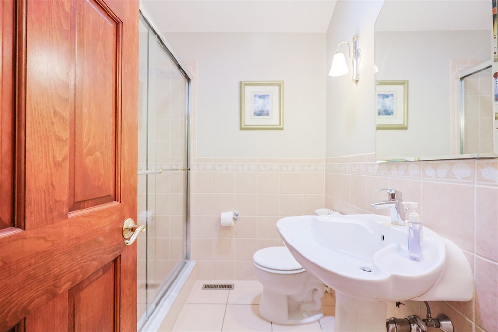 60 Deerfield Road Needham, MA 02492 - Photo 26 of 31 a bathroom with a sink toilet and shower