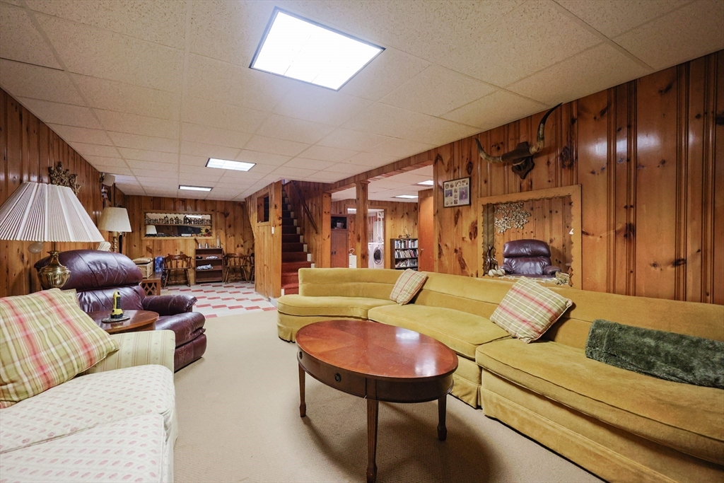 60 Deerfield Road Needham, MA 02492 - Photo 30 of 31 a living room with furniture and a chandelier