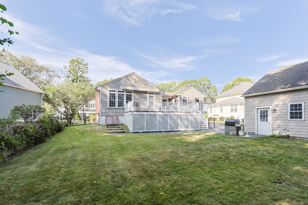 60 Deerfield Road Needham, MA 02492 - Photo 4 of 31 a view of a house with a big yard and potted plants