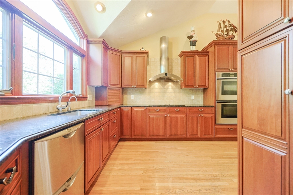 60 Deerfield Road Needham, MA 02492 - Photo 10 of 31 a large kitchen with stainless steel appliances granite countertop a refrigerator and a sink