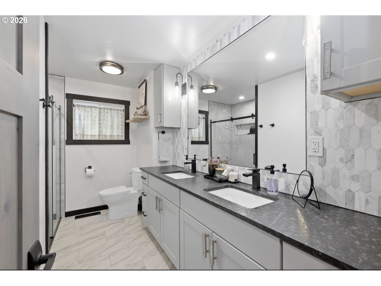 33192 Wilkins Road Eugene, OR 97408 - Photo 25 of 35 a bathroom with a sink double vanity granite and a toilet
