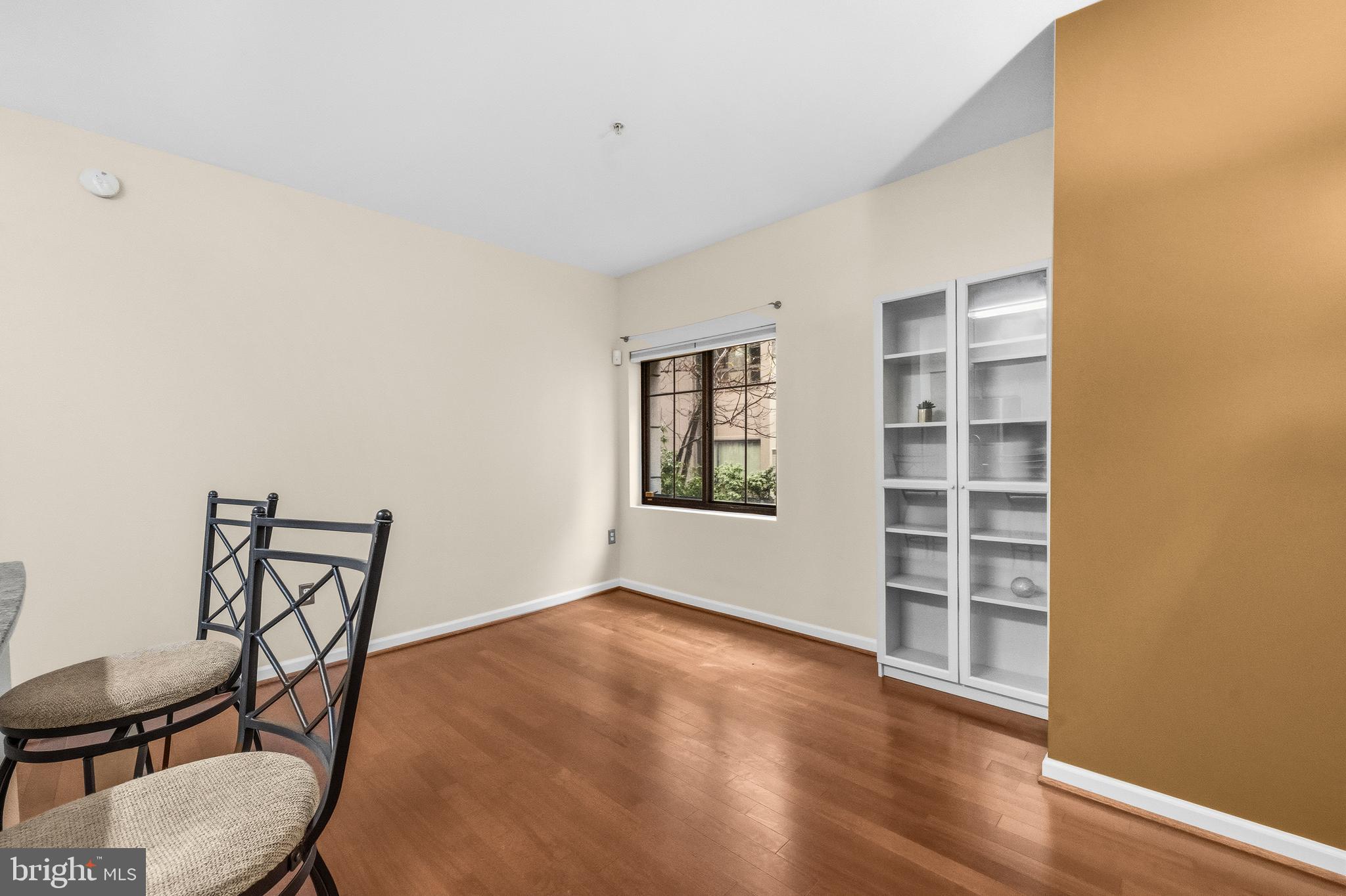 7923 Eastern Avenue Northwest, Unit 105 Silver Spring, MD 20910 - Photo 12 of 32 a view of room with lounge chair and wooden floor