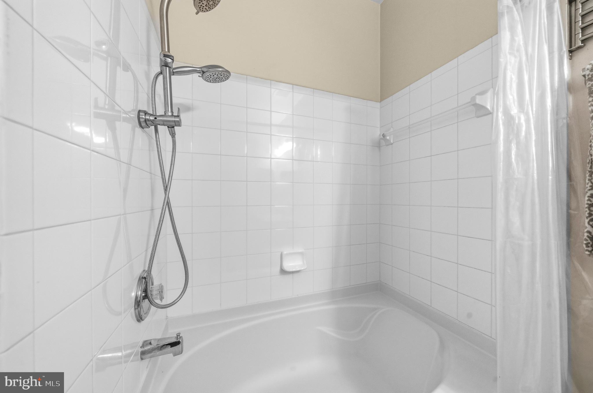 7923 Eastern Avenue Northwest, Unit 105 Silver Spring, MD 20910 - Photo 16 of 32 a bathroom with a shower