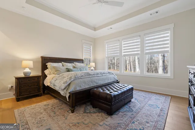 a bedroom with a bed lamp and a fireplace