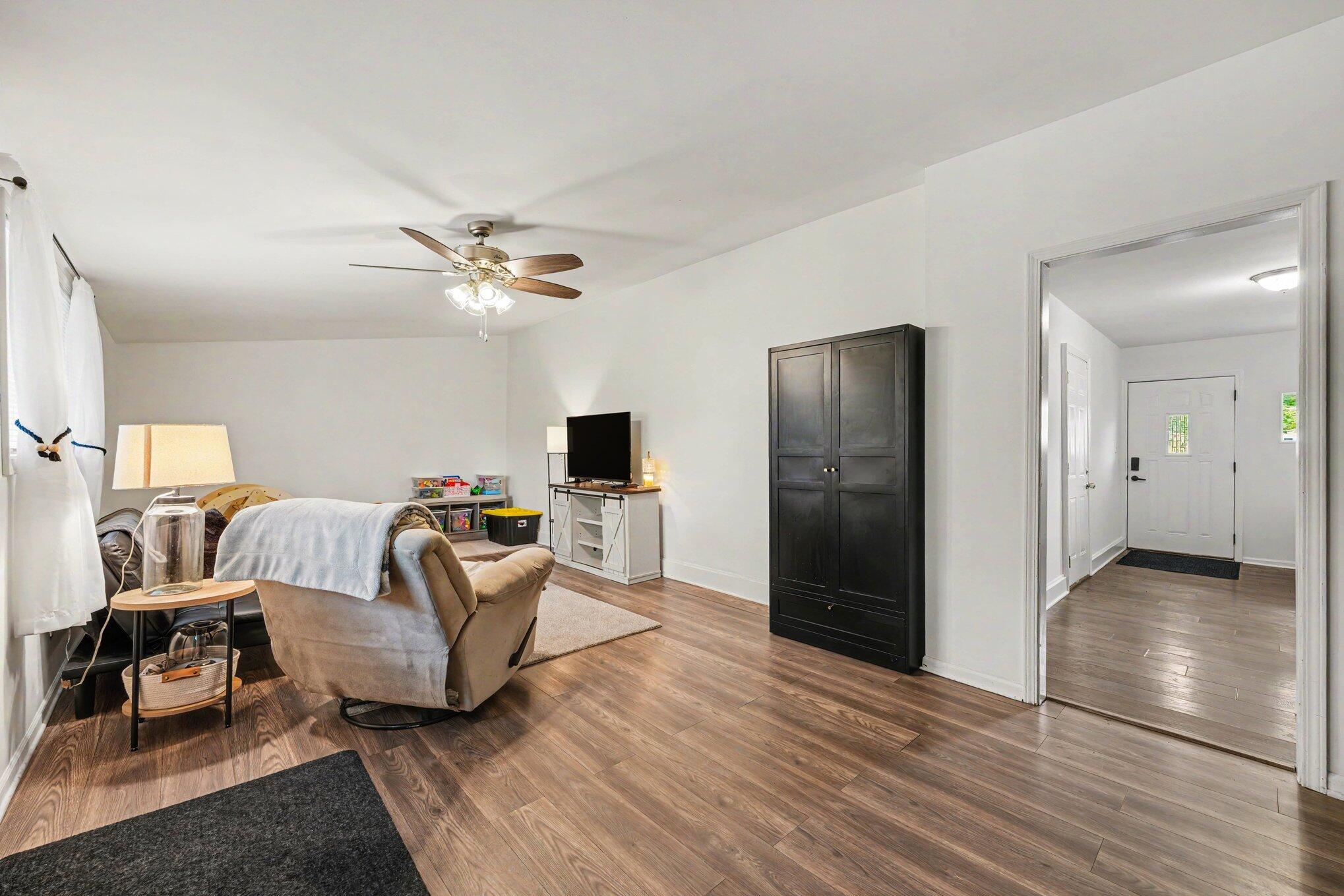 835 North Indiana Street Griffith, IN 46319 - Photo 10 of 19 a living room with furniture and a ceiling fan