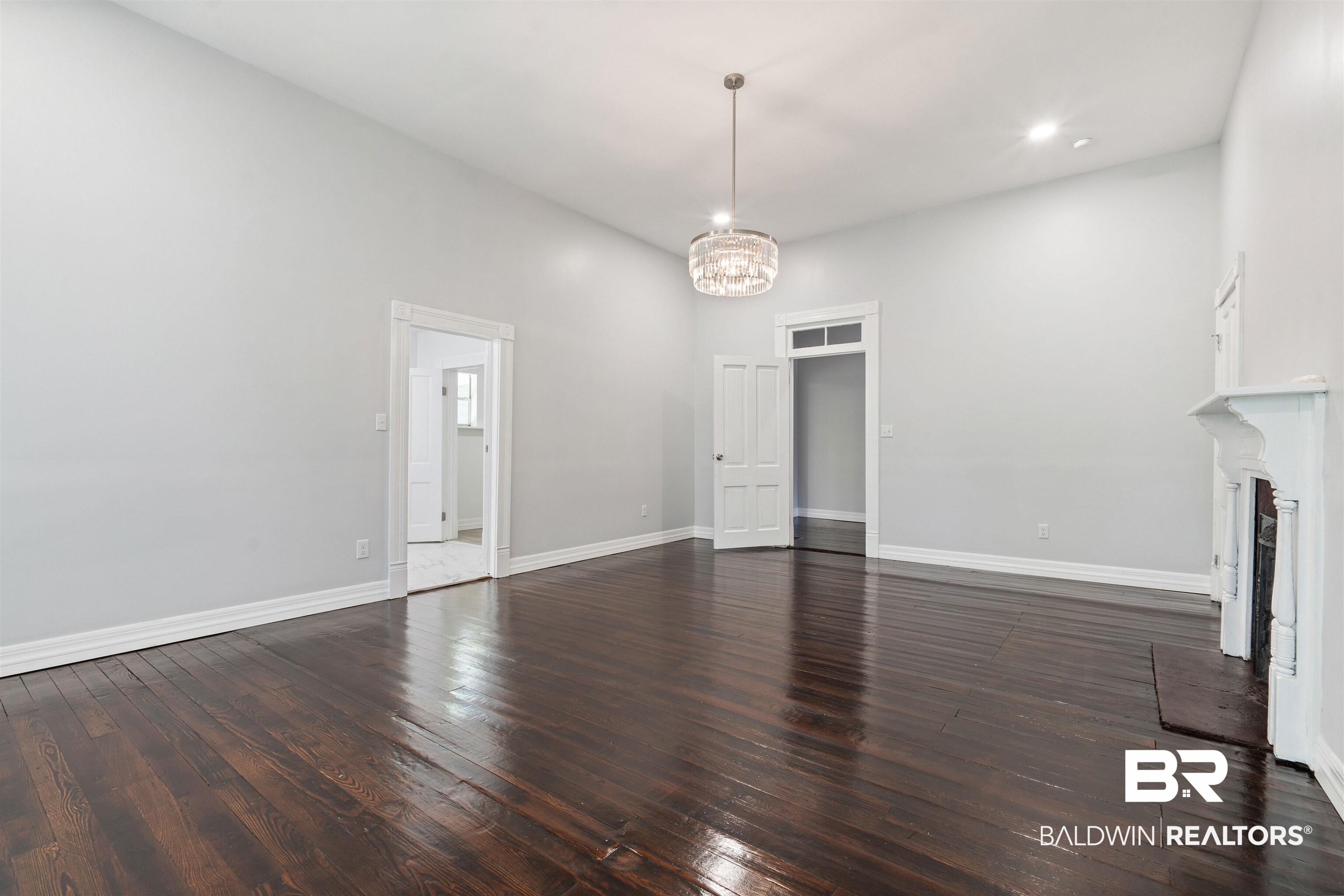 407 East 2nd Street Bay Minette, AL 36507 - Photo 34 of 40 Unfurnished living room featuring dark wood-style floors, a chandelier, and recessed lighting