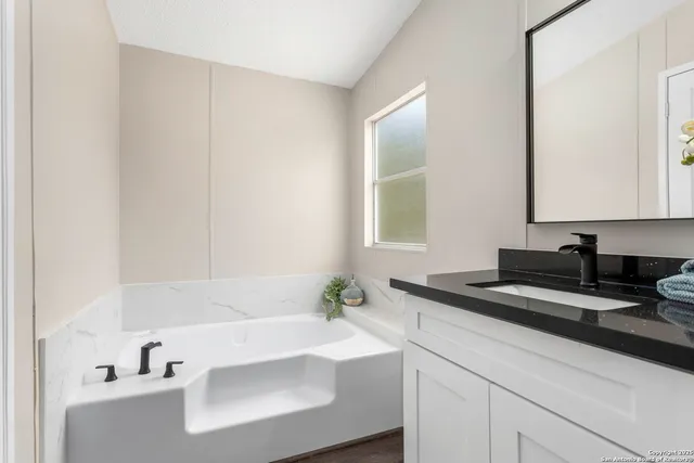 a bathroom with a sink and a bathtub