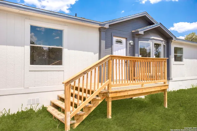 a view of backyard with deck