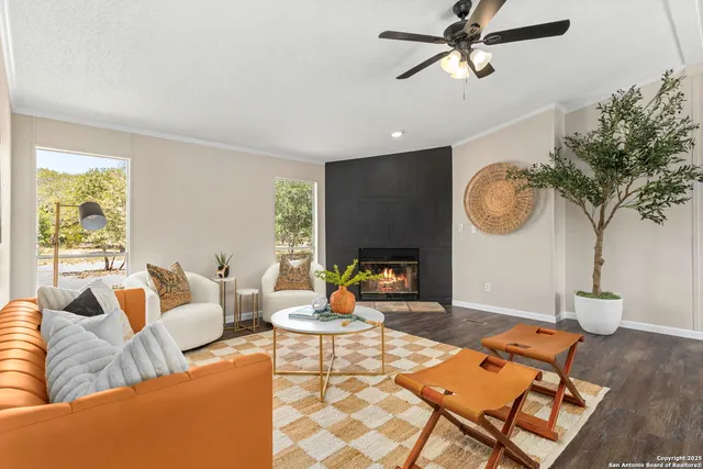 a living room with furniture and a fireplace