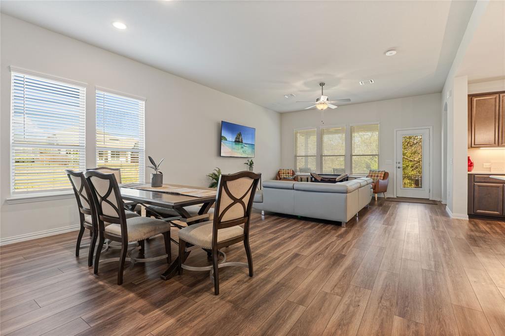 9517 Sunset Lane Oak Point, TX 75068 - Photo 8 of 40 9517 Sunset Lane, Oak Point, TX 75068 - dining area - Dining room with dark wood-style floors, ceiling fan, and recessed lighting