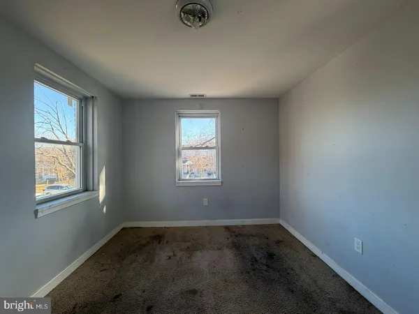 an empty room with windows