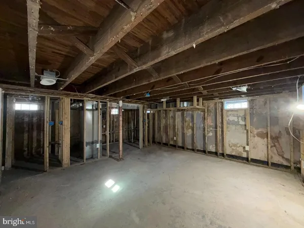 a view of an empty room with wooden walls