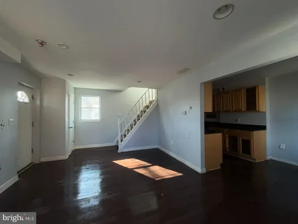 a view of an entryway with wooden floor