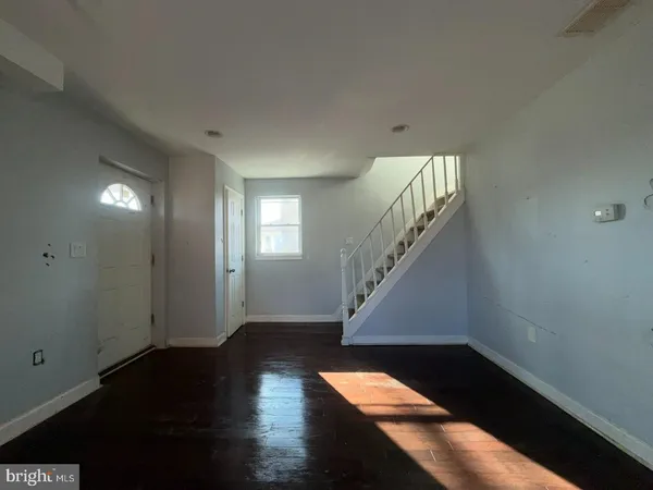 a view of entryway with wooden floor