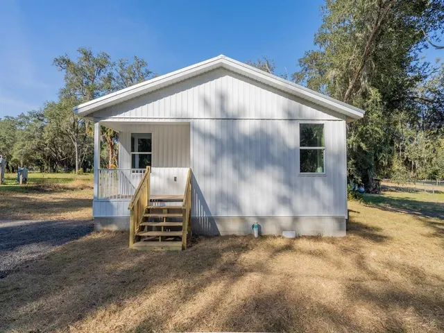 a front view of a house with garage