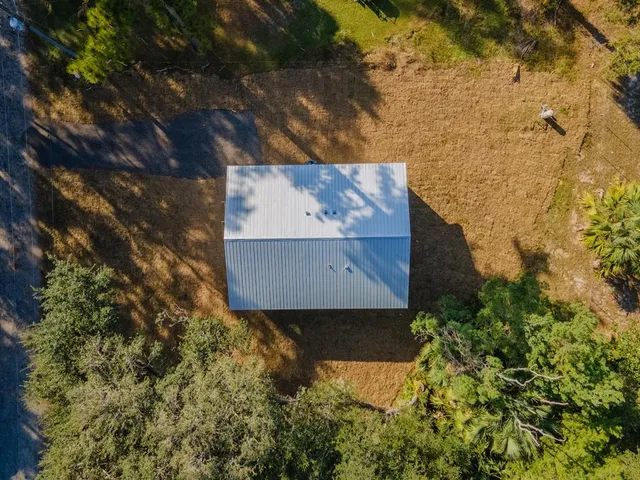 a view of a tree with a yard