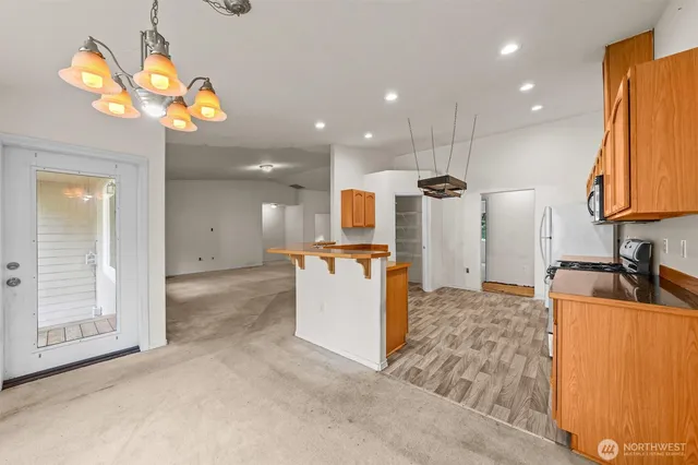 a view of a kitchen with a sink storage and utility
