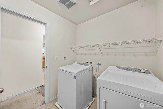 a utility room with dryer and washer
