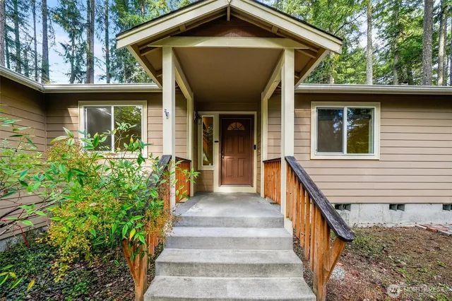 a view of a house with large windows