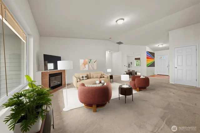 a living room with furniture a fireplace and a flat screen tv