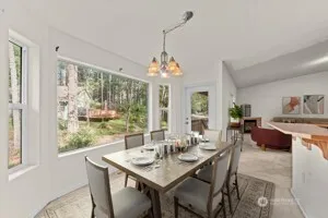 a view of a dining room with furniture window and outside view