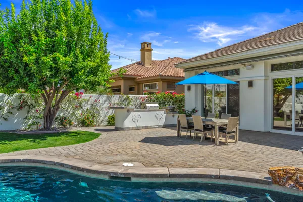 a view of a swimming pool with a yard