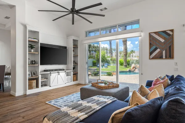 a bathroom with a bathtub a sink a window and a shower